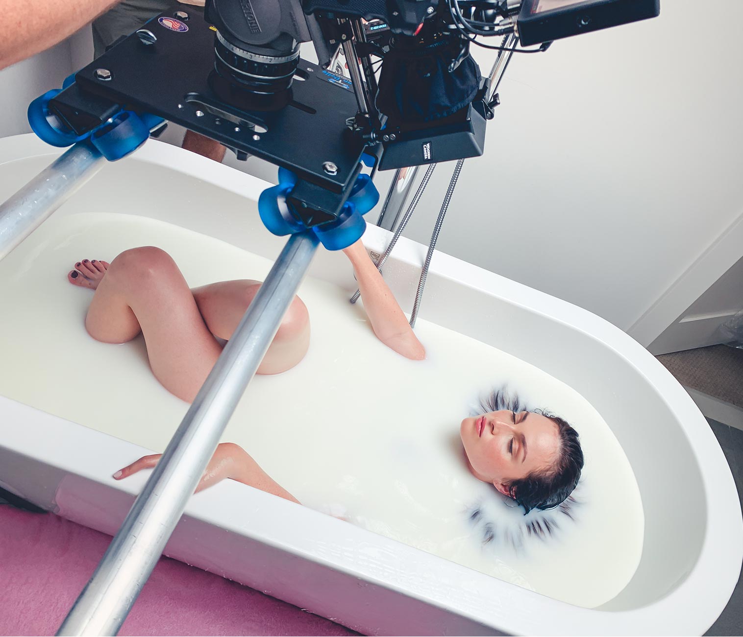 Cinema camera on a slider composing a wellness production still