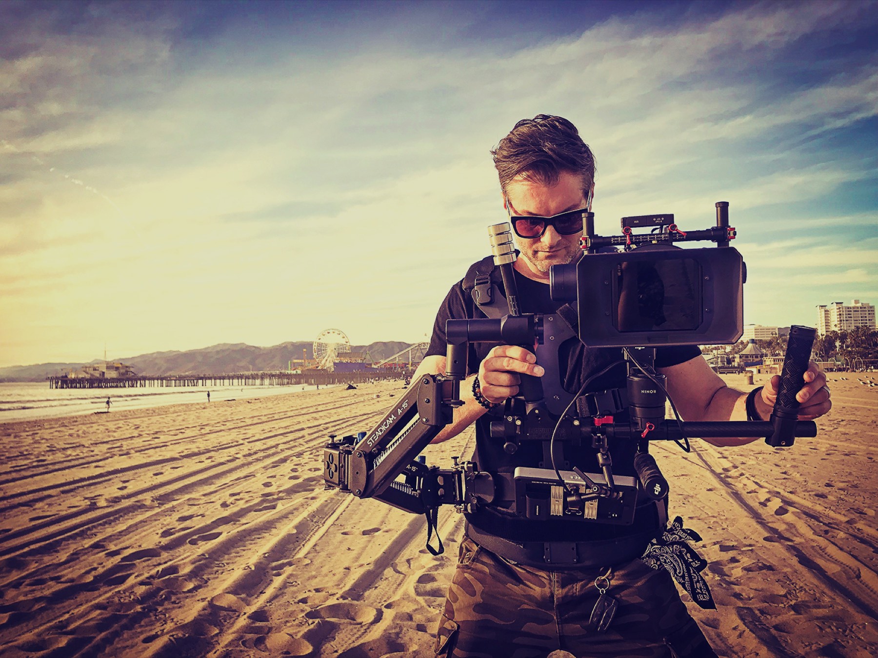 Kyle Cassie operating a steadicam on location